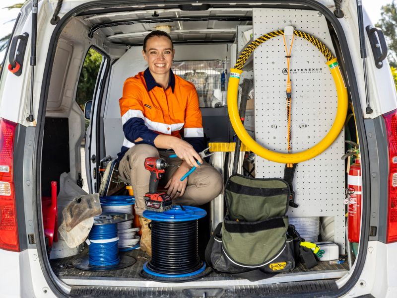 female electrician in van