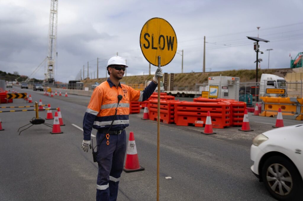 Jermaine with SLOW sign. 